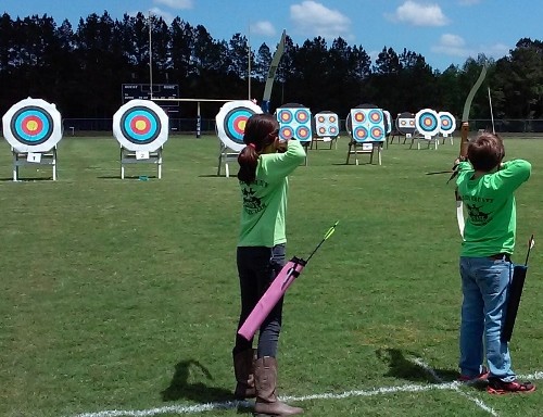 Project SAFE participants at an archery range